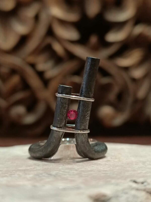 Wrought iron silver and pink stone ring.