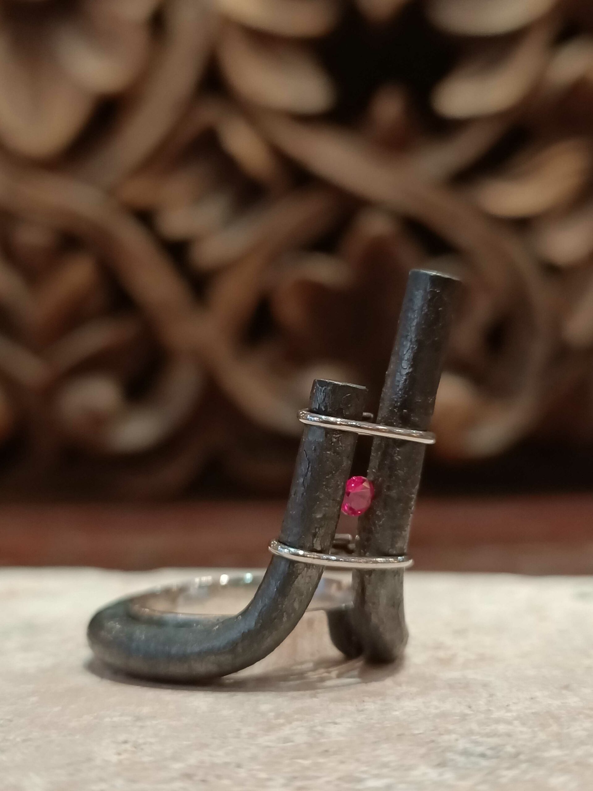 Wrought iron, silver and spinel ring by Marianne Anselin