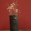 Enamelled black stoneware and brass vase by Meig.
