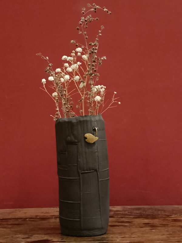 Enamelled black stoneware and brass vase by Meig.
