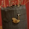 Enamelled black stoneware and brass vase by Meig.