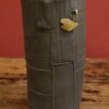Enamelled black stoneware and brass vase by Meig.