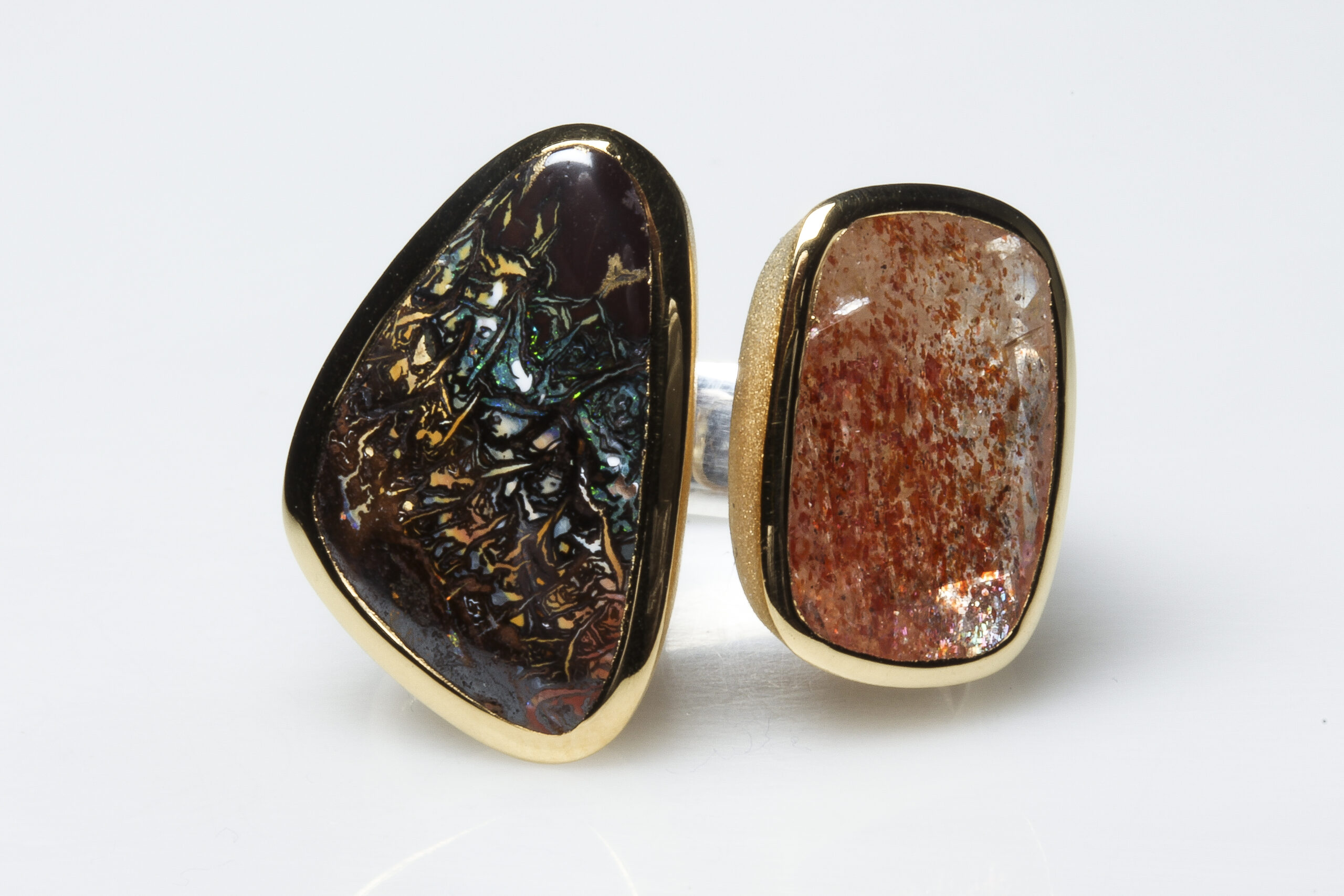 Boulder opal, sunstone, silver and vermeil ring. Boulder opal, sunstone, brushed silver and mat vermeil ring.