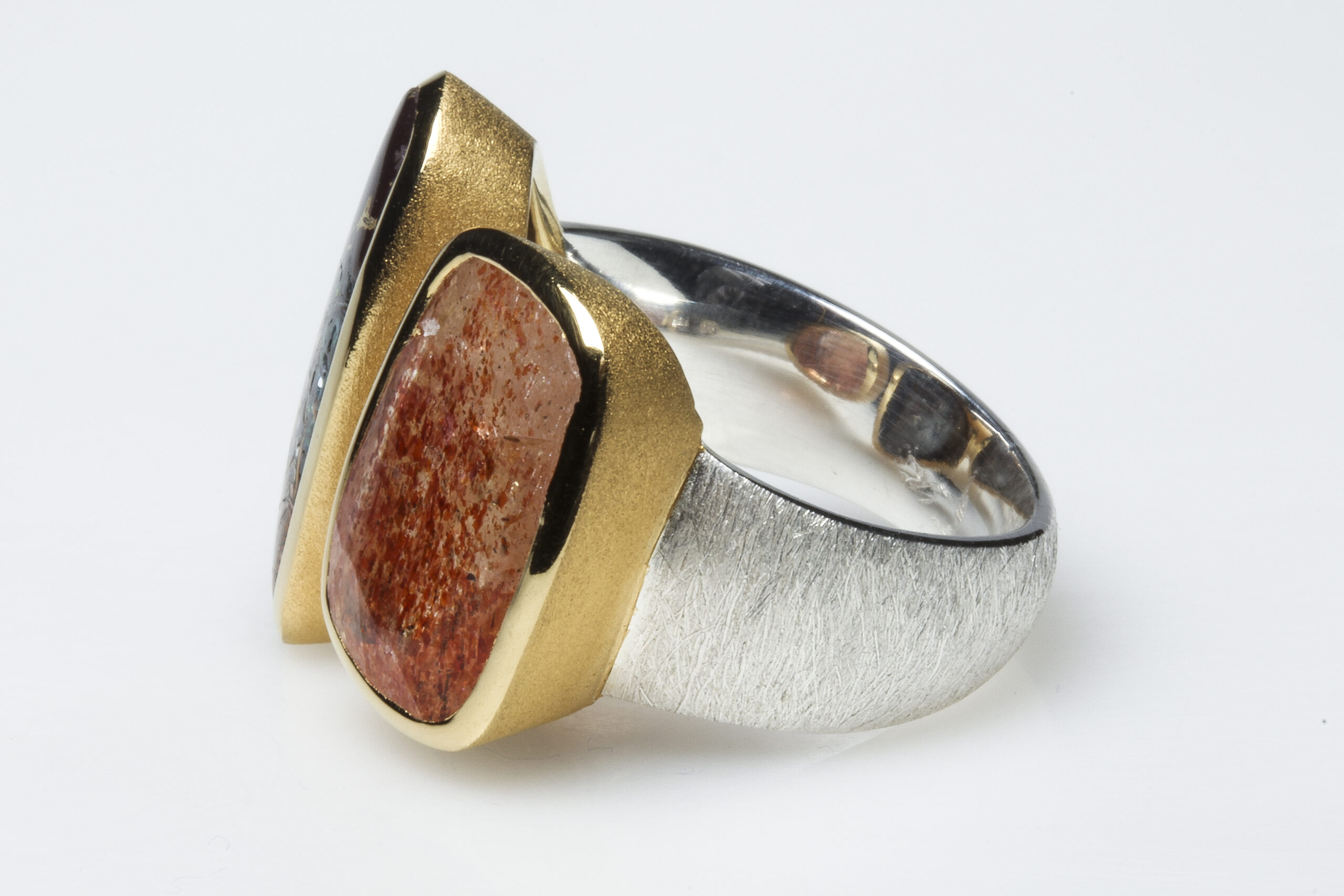 Boulder opal, sunstone, silver and vermeil ring. Boulder opal, sunstone, brushed silver and mat vermeil ring.