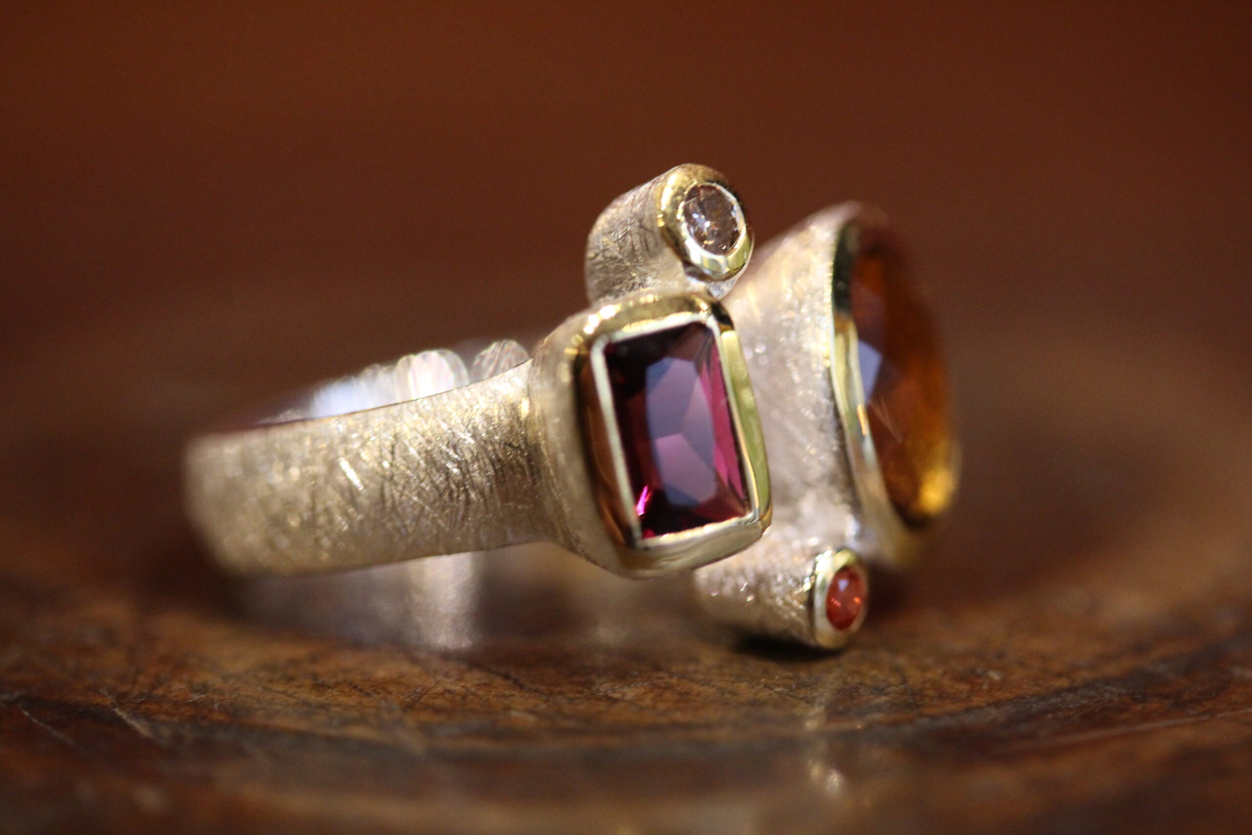 Silver, vermeil, citrin, rhodolite,sapphire and diamond ring Silver, vermeil, citrin, rhodolite,sapphire and diamond ring.