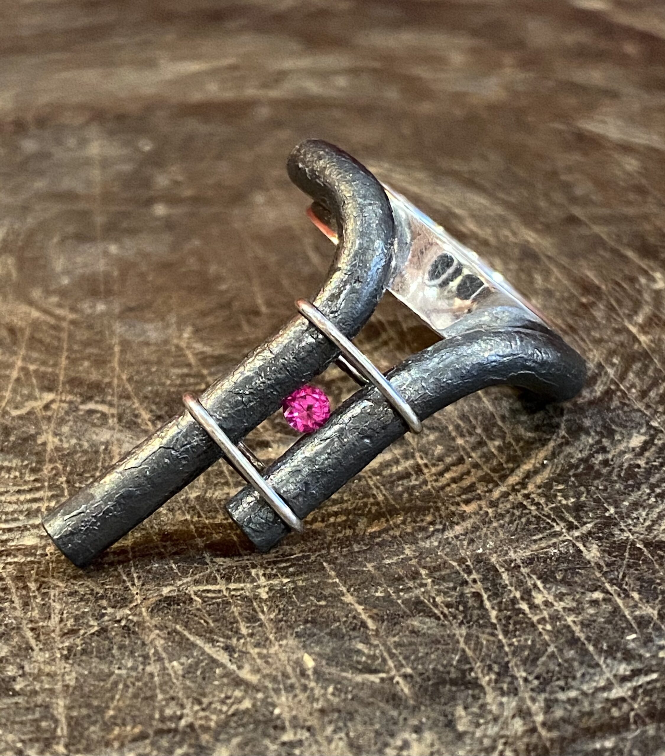 Wrought iron, silver and spinel ring by Marianne Anselin