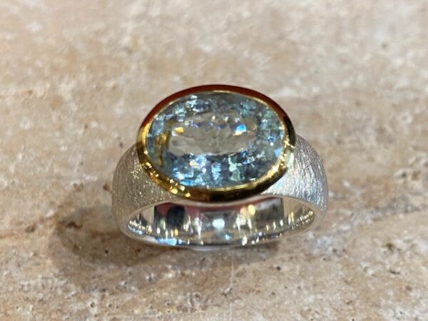 Brushed silver, vermeil and aquamarine ring.