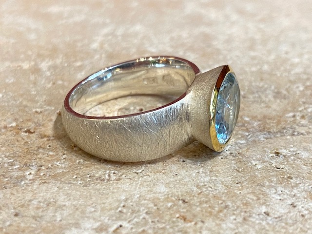 Brushed silver, vermeil and aquamarine ring Brushed silver, vermeil and aquamarine ring.