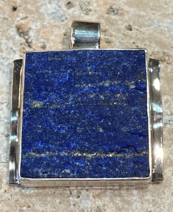 Sterling silver pendant with lapis lazuli.