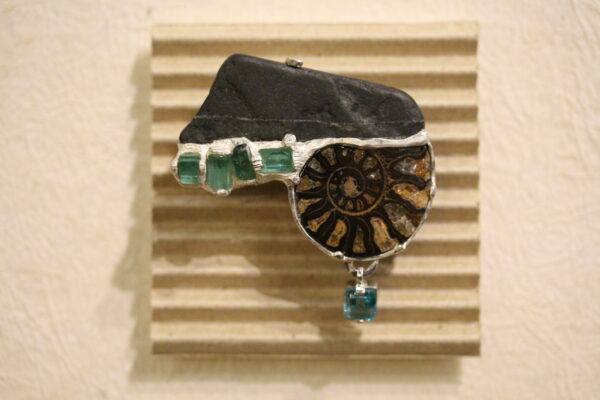 Black stone, amonite, tourmaline, apatite and silver brooch by Hélène Thomas.