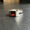 Very bright garnet set on a sterling silver ring.