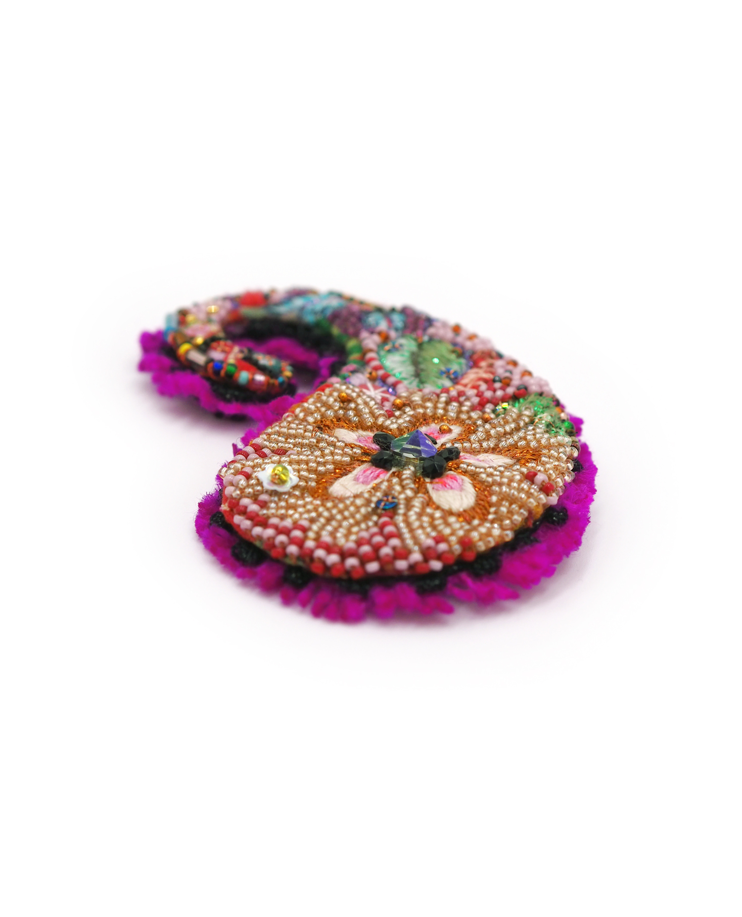 Textile brooch "Naïve" by Isabelle Mariana Textile brooch by Isabelle Mariana.