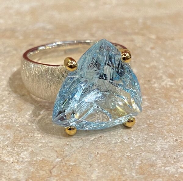 Brushed silver, vermeil and topaz ring.