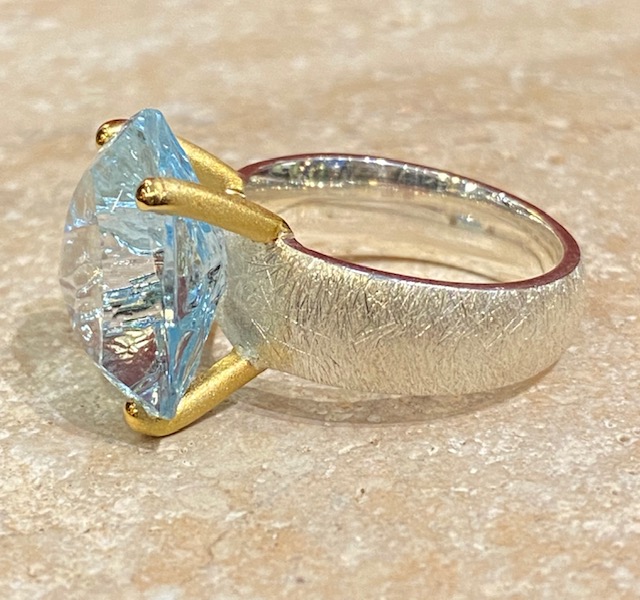 Brushed silver, vermeil and topaz ring.