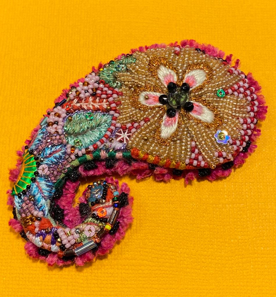 Textile brooch "Naïve" by Isabelle Mariana Textile brooch by Isabelle Mariana.